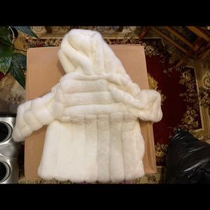 Rothschild child’s white hooded fur coat